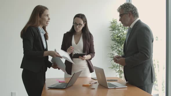 Manager Presenting Project Reports To Partners