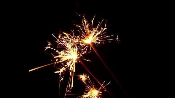 Several Firework Sparklers Over Black Background