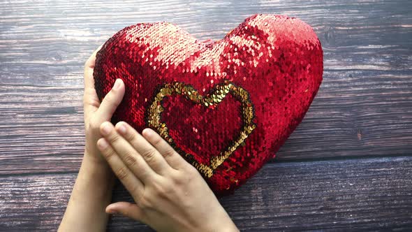 Women Holding Red Heart in Hands