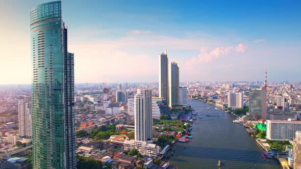 4K UHD : Aerial view over the Chao Phraya River and Buildings of Bangkok