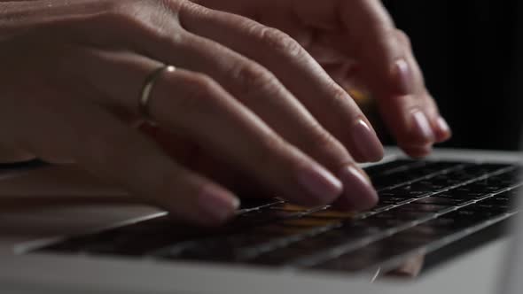 Woman Typing on Laptop Keybord