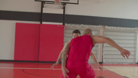 Two African American Athletes Playing Basketball