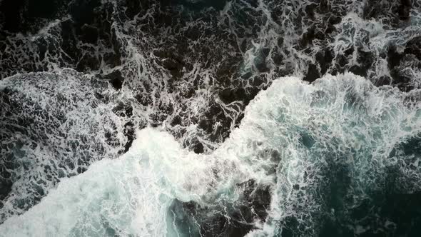 Bird's Eye View of Waves Crashing on a Rocky Coast