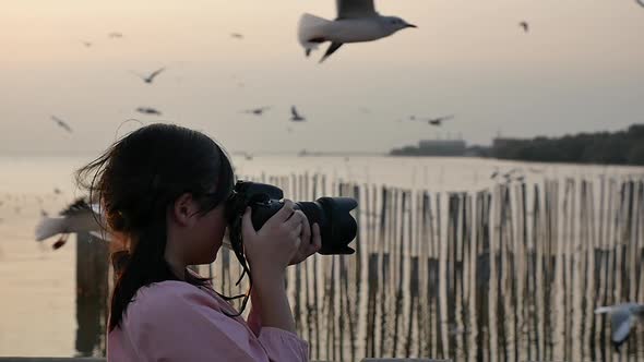 Beautiful Asian Girl Taking Pictures Outdoors