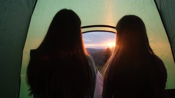 Two Girls Girlfriends are Resting in the Alps They are Having Fun