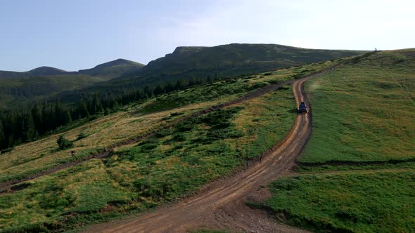 Off Road Vehicle Moving By Mountains Trail