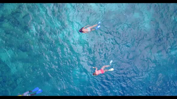 Aerial flying over texture of beautiful resort beach trip by clear sea with white sand background of