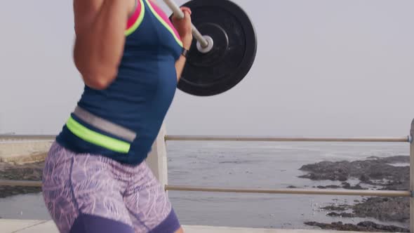 Caucasian woman working out on the docks