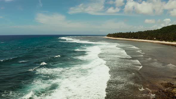 The Coast of Siargao Island, Blue Ocean and Waves