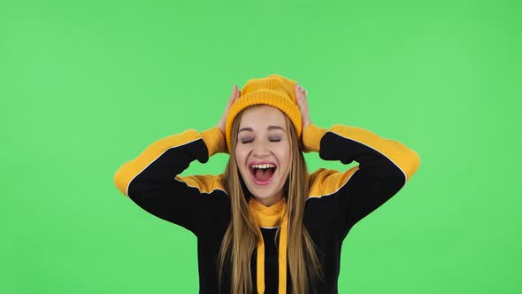 Portrait of Modern Girl in Yellow Hat with Shocked Surprised Wow Face Expression Is Rejoicing