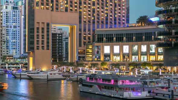 View of Dubai Marina Towers and Canal in Dubai Day to Night Timelapse