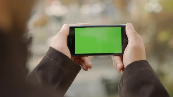 Man Hands Touching Cellphone with Greenscreen, Unknown Guy Holding Mock Up Phone