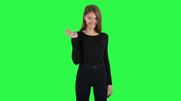 Young Woman Coquettishly Smiling, Waving Hand and Showing Gesture Come Here. Green Screen