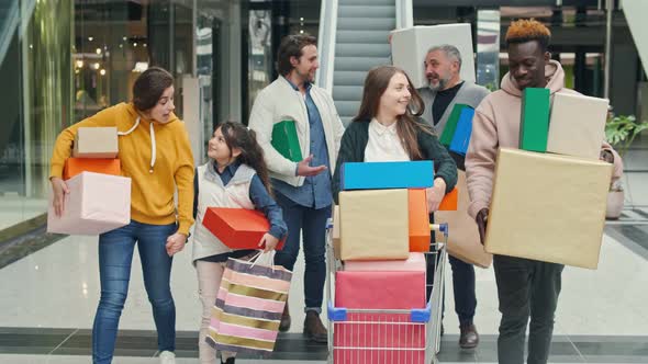 Happy Group of People Spending Weekends in the Shopping Mall.