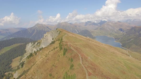 Aerial drone view of mountain biker biking in the mountains.