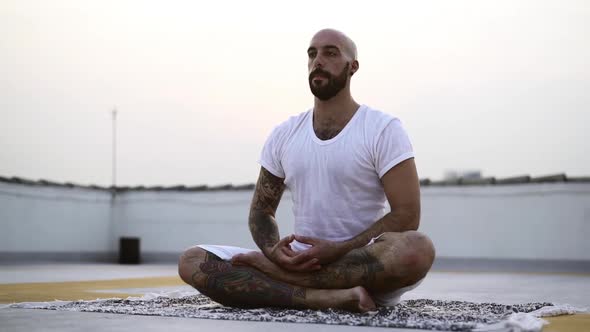 Gentleman Sweating Through His White Shirt While Meditating