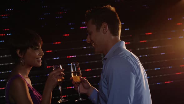 Couple drinking champagne in bar