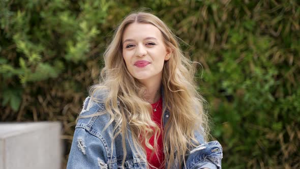 Smiling Woman in Denim Outfit