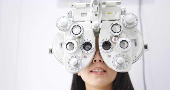 Woman check on eye in clinic