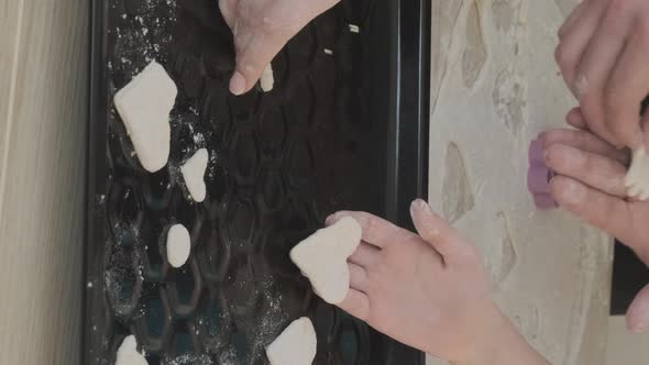 Family of Three Put Raw Cookies on the Sheet