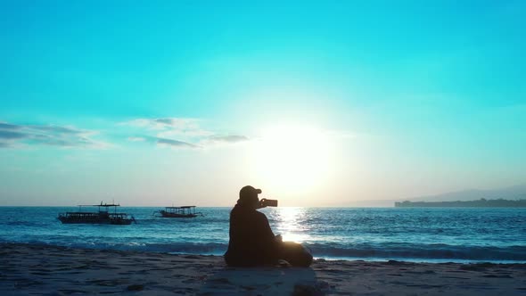 Single female sunbathes on exotic coastline beach holiday by clear water and white sand background o