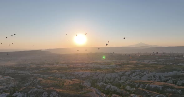 Aerial View of Natural Rock Formations in the Sunset Valley with Cave Houses in Cappadocia Turkey