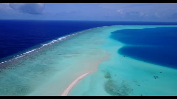 Aerial seascape of idyllic bay beach trip by turquoise ocean with white sand background of adventure