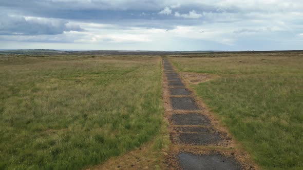 Remains of RAF Danby Beacon, a listening station from WWII - low level aerial shot following access