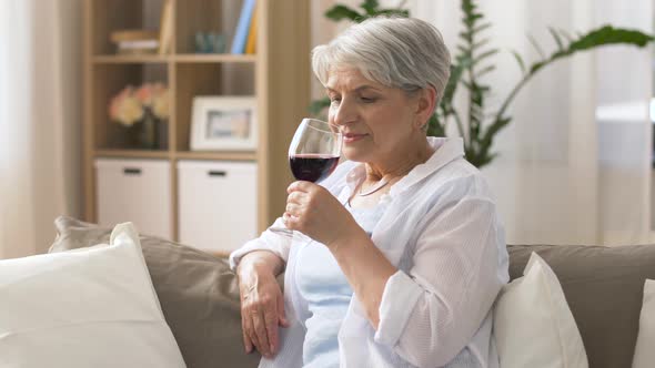  Senior Woman Drinking Red Wine From Glass at Home 21