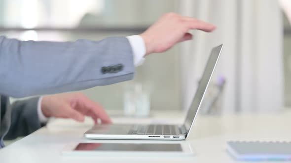 Close Up of Businessman Opening and Typing on Laptop