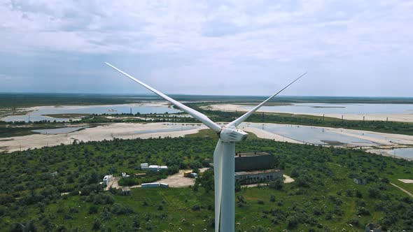 Large Wind Turbines with Blades in Field Aerial View