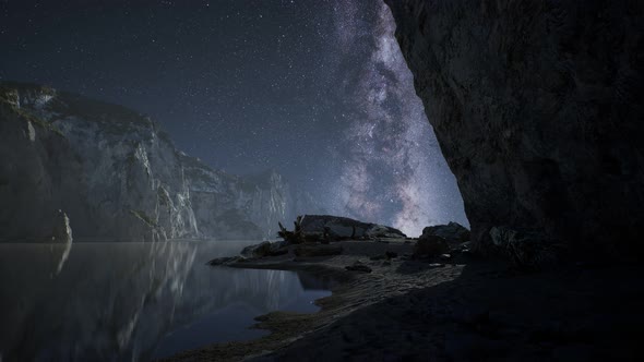 Hyperlapse of Night Starry Sky with Mountain and Ocean Beach in Lofoten Norway