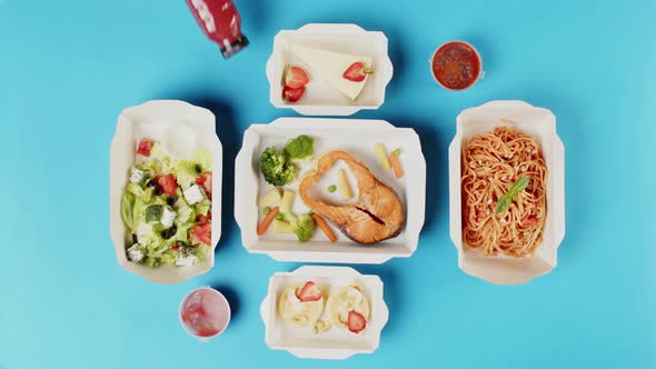 Food Delivery Top View Take Away Meals in Disposable Containers on Blue Background