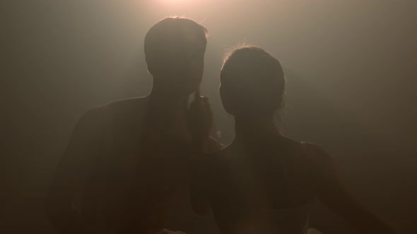Professional Ballet Couple Dancing in Spotlights Smoke on Big Stage. 