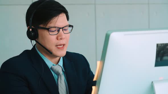 Business People Wearing Headset Working in Office