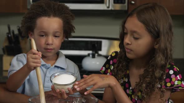 Slow motion of girl pouring in sugar