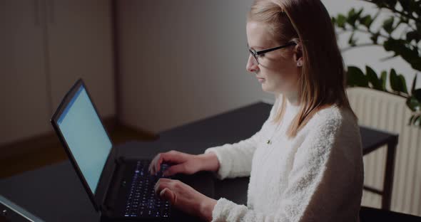 Businesswoman Working on Laptop Browsing Internet Reading Emails Home Office