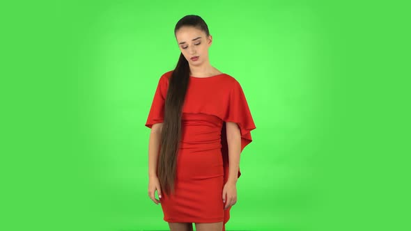 Pretty Young Woman Is Upset and Tired. Green Screen