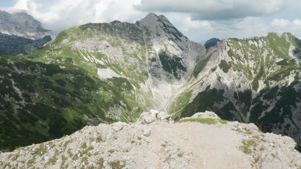 Drone Flight Over Mountain Edge To Valley