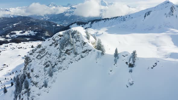 Aerial view of mountains with snow in Onnion, France.