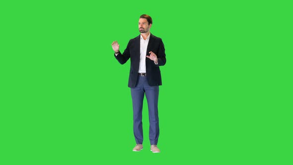 Businessman Touching on a Virtual Screen on a Green Screen Chroma Key