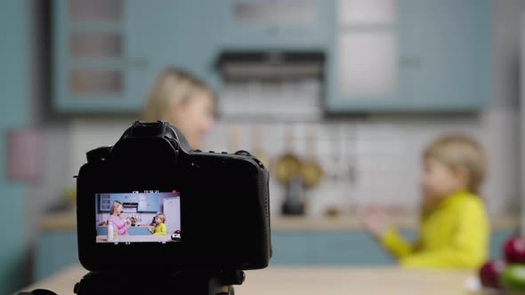 Focus on Camera Screen with Woman and Boy Having Fun Dancing and Making Funny Video