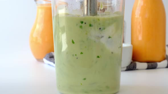 Woman Cooking Healthy Smoothie Add Green Apple Kiwi Spinach Blended in Blender Green Smoothies