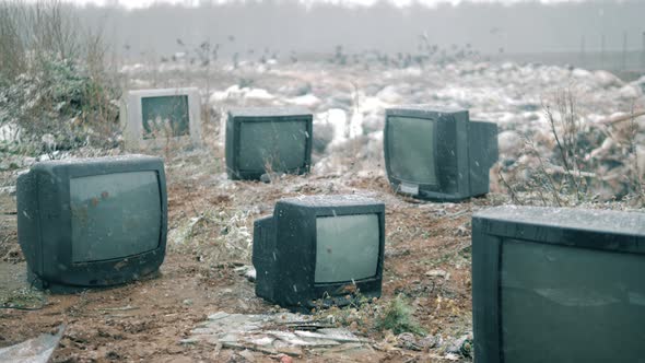 Snowfall at the Grabage Dump with Thrownout TVs