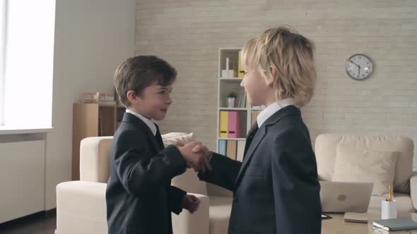 Two Business Kids Shaking Hands