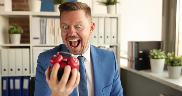 Crazy Smiling Businessman Holding Alarm Clock and Waving Hand  Movie