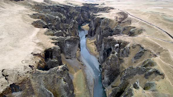 Iceland Cinematic Nature drone flying over deep dramatic canyon with jagged cliffs