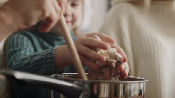 Video of little girl helping while preparing food. Shot with RED helium camera in 8K.