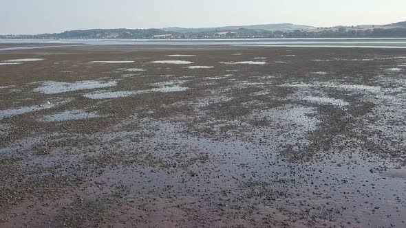 Smooth aerial tilt up of River Exe, Lympstone.