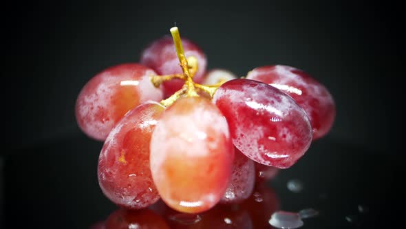 Red juicy eco fruity grapes chunk on turntable